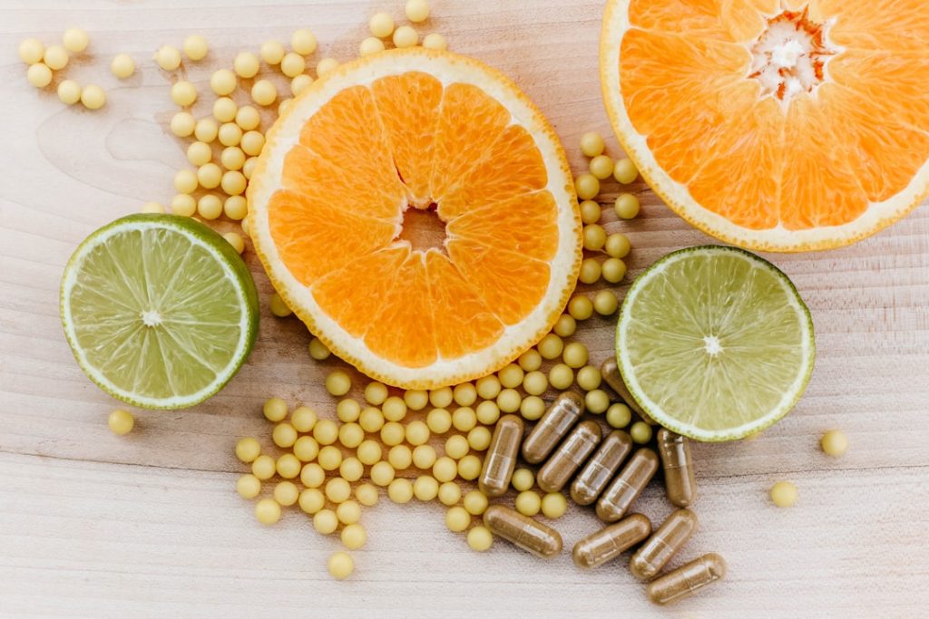 oranges-peas-and-limes-on-a-wooden-table-6ifojsrktcg